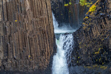 Closeup View Of Waterfall And Basaltic Rocks