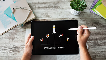 Wall Mural - marketing strategy diagram on device screen. business concept.