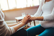© Dragana Gordic - Pregnant woman on home counselling meeting. You're not in this alone. Depressed pregnant woman consultation with psychologist. Psychiatrist holding hands patient,such as making a fresh start