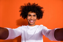 Photo Of Funny Charming Guy Dressed White Shirt Smiling Tacking Selfie Isolated Orange Color Background