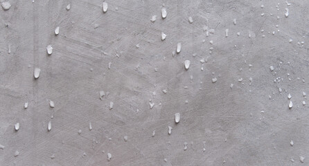 Wall Mural - rain drops on cement wall background 