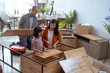 © Odua Images - asian family at their new house buying and assembling new furniture.