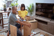 © Odua Images - asian father and daughter assembling new furniture at their home
