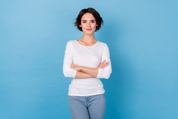 Photo of charming adorable business lady with folded hands professional worker isolated on blue color background