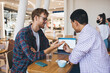 © BullRun - Multiracial business men working in office space
