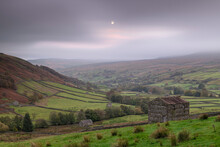 Moon Rising Above Stone Barns In Swaledale, Yorkshire Dales National Park, Thwaite, North Yorkshire, England