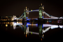 Tower Bridge And Reflections In The River Thames At Night, London, England
