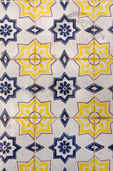  old tiles in Portugal, blue,yellow,and white color, photography takes in buildings of Portugal