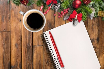 Wall Mural - New year goals 2022 concept on desk. notebook, coffee cup  on wooden background.