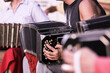 Close-up of Argentine bandoneon player performing on the street playing tango music with orchestra in Buenos Aires, Argentina.