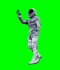 Wall Mural - Astronaut isolated on green background perfect for photo compositing