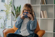 © carballo - woman at home with a cup of coffee or infusion