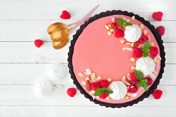 Poster - Gourmet raspberry chocolate pie. Above view table scene on a white wood background. Spring baking concept.