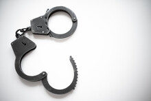 Open Metal Handcuffs On White Isolate. Release From Prison. The End Of The Arrest.
