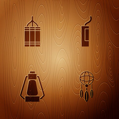 Wall Mural - Set Dream catcher with feathers, Dynamite bomb, Camping lantern and on wooden background. Vector