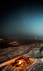 Wall Mural - camp fire under a starry sky at selmun malta