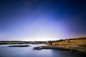 Wall Mural - Night Sky over Delimara Cove in Malta