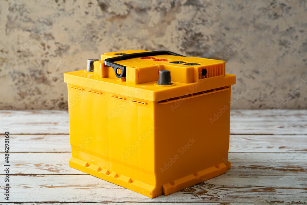 Modern car battery on table