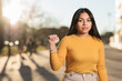 © Sangiao_Photography - ecuadorian young woman doing the help symbol signal for domestic violence or kidnap gesture