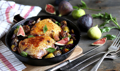 Poster - chicken with figs. dish with figs. fried chicken with figs and onions in pan. Soft focus.