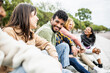 © Xavier Lorenzo - Diverse group of young people laughing together - Hispanic latin man smiling at camera while having fun with multiracial friends in city street - Friendship, unity and millennial colleagues concept