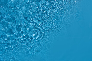 Wall Mural - Shining blue water ripple background. Summer concept.