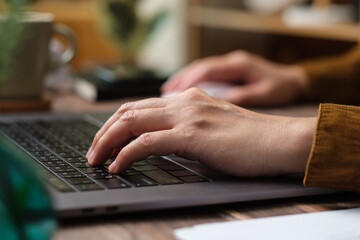 Poster - close up hand typing on laptop keyboard when woking at home
