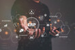 © OMEGA - Close up of businessman hand holding to ERP Corporate Company Management Business Internet Technology Concept.