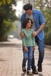 © IndiaPix - Father and son together walking in the park