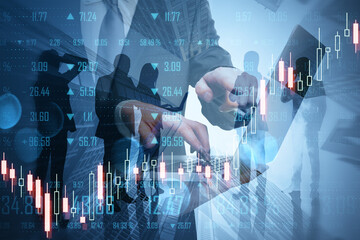 Poster - Businesspeople using laptop working together on abstract city background with forex chart. Teamwork, trade, finance and technology concept. Double exposure.