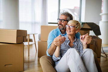 Poster - Portrait of happy senior couple in love moving in new home