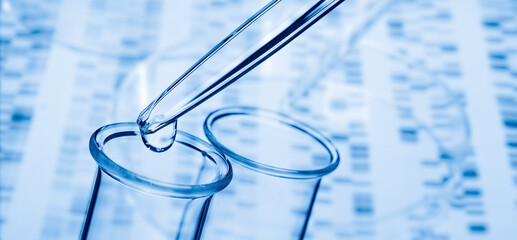 Wall Mural - pipette and test tube with dna in the background