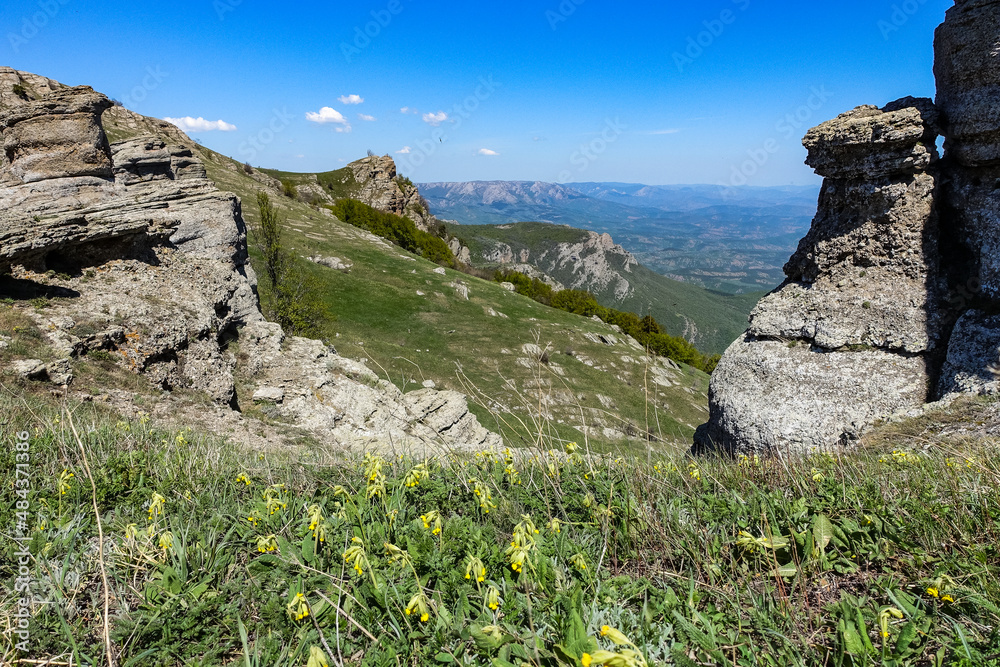 Valley S With Rounded Rocks Ancient limestone high mountains of rounded shape in the air haze. The ...