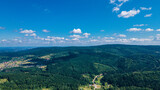 Fototapeta Do pokoju - mountains aerial view in blue sky clouds