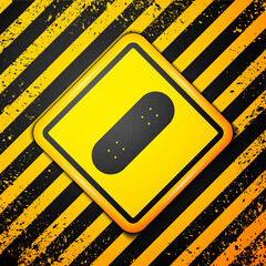 Wall Mural - Black Skateboard icon isolated on yellow background. Extreme sport. Sport equipment. Warning sign. Vector