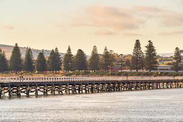 Wall Mural - Victor Harbor causeway viewed from the Granite Island at sunset time, Fleurieu Peninsula, South Australia