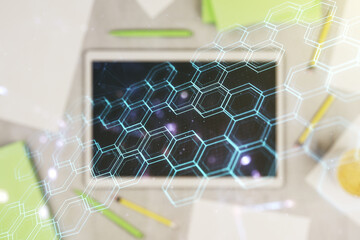 Poster - Creative concept of wireless technology with hexagon hologram and modern digital tablet on background, top view. Big data and database concept. Multiexposure