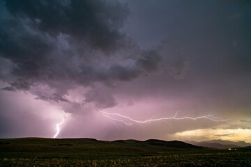 Wall Mural - Lightning bolt during storm spanning the landscape