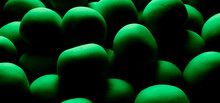 Green Balls In Low Light Background Or Texture