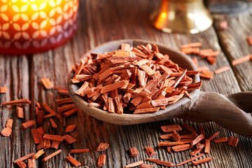 Wall Mural - Red sandalwood on a wooden spoon