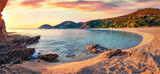 Fototapeta Sypialnia - Panoramic summer view of Cheromylos beach. Splendid sunrise on Euboea island, Greece. Calm Aegean seascape. Beauty of nature concept background.
