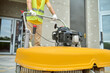 © zinkevych - Workman applying a road sweeper on the construction site