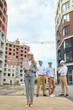 © zinkevych - Focused construction inspector scrutinizing project documentation outdoors