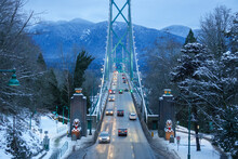 View Of Lions Gate Suspension Bridge In Vancouver, British Columbia, Canada At Night In Winter Full Of Lights