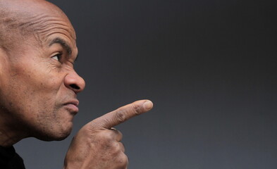 businessman pointing his finger in the office with a suit stock photo