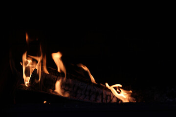 Firewood in a bright flame. Big fire burning wood