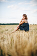 © Anhelina  - A beautiful girl and a field on which they threshed grain. Woman after harvest. Girl and yellow field