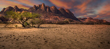 A Panorama View Of The Colorful Sunset Over The Safari In Spitzkoppe, Namibia
