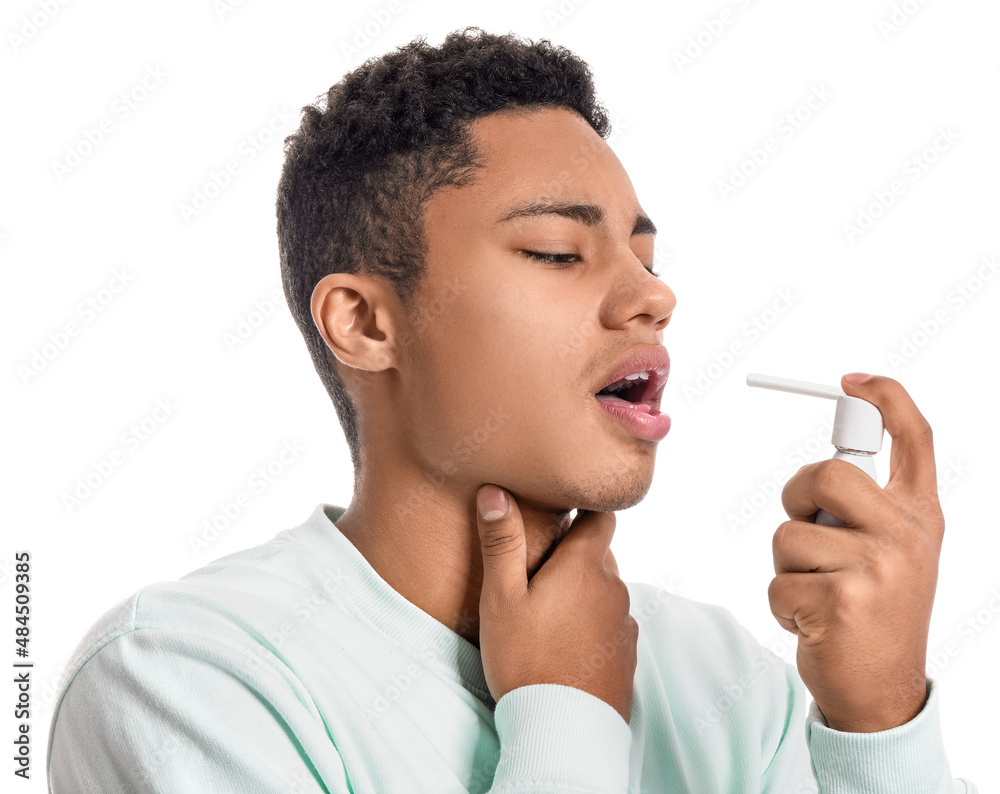 Ill African-American guy with inhaler on white background