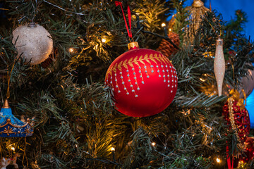 Poster - A closeup of a beautiful Christmas tree decorated with ornaments